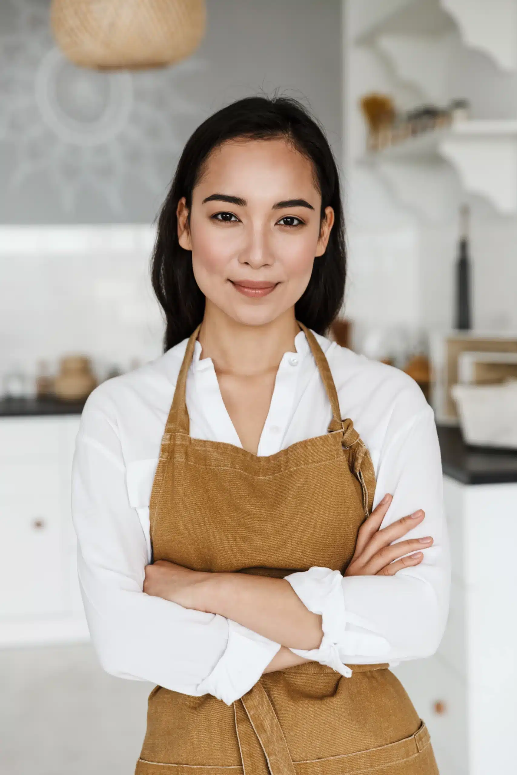 smiling attractive young asian woman wearing apron 2025 02 16 00 22 54 utc scaled